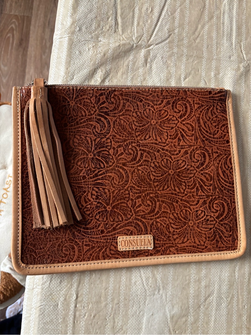 Consuela Brown Embossed Floral Leather Wristlet with Tan Trim